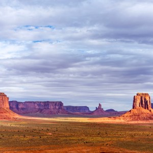 The seemingly endless spires and red rock formations of Monument Valley, with a vast sky of clouds create an epic scene, one fit for the movies!