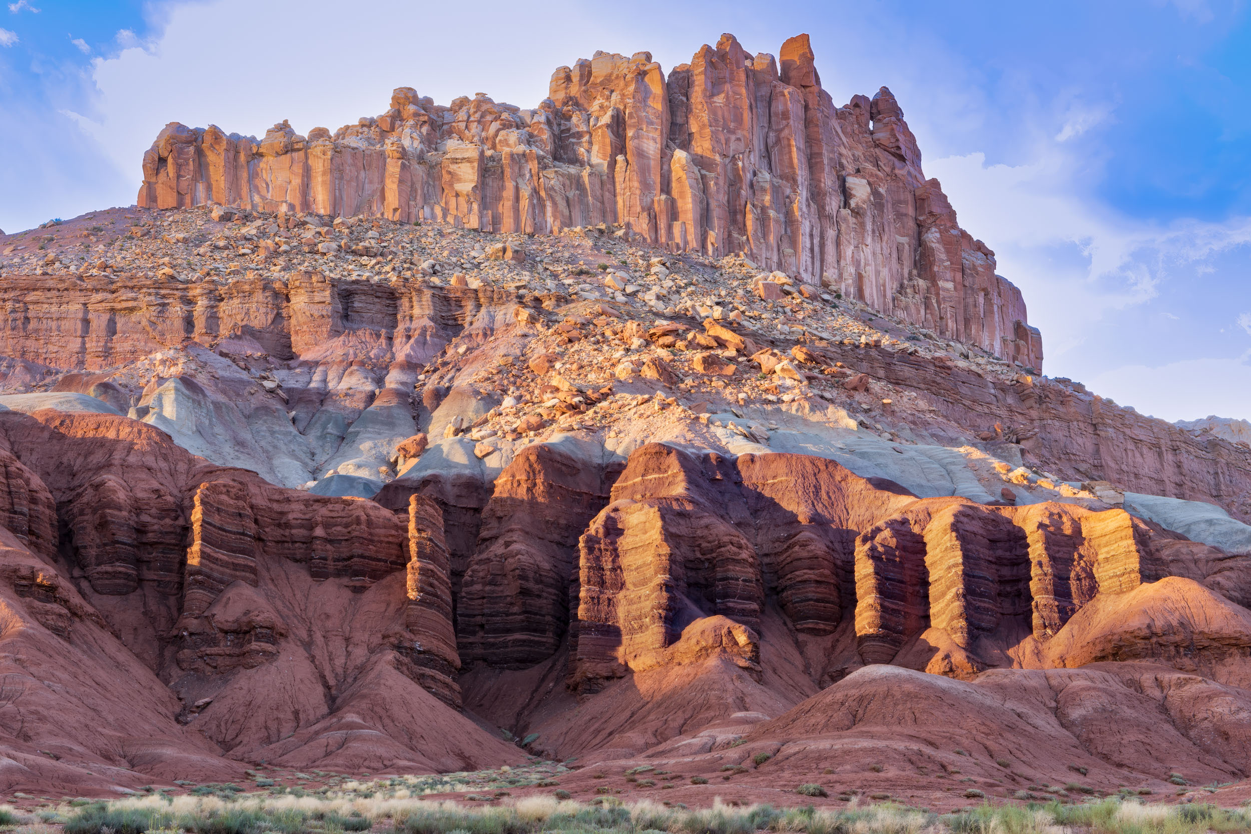 This elegant, colorful red, pink and orange rock formation in Capitol Reef National Park in southern Utah juts out of the earth like the crown of a queen.